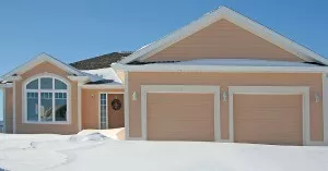 House with garage doors in winter