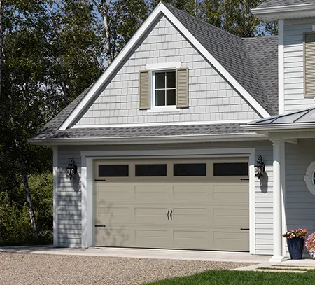 Garage door in the Vantage Shaker-Slat Two design in the Sandstone color