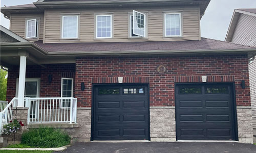 Acadia 138 garage doors, 8' x 8', Black, Clear windows with Stockton Inserts