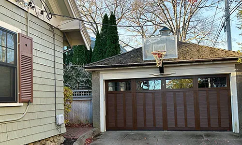 Eastman E-13 garage door, 16' x 7', Chocolate Walnut door and overlays, 8 lite Panoramic windows with Clear glass