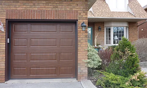 Brick brown house with Classic MIX garage door, 8' x 7', American Walnut colour, Faux Wood
