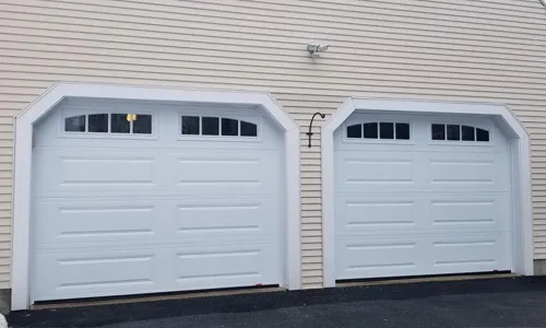 House with Classic XL garage door, 9' x 7', Ice White windows with Richmond Arch Long Inserts